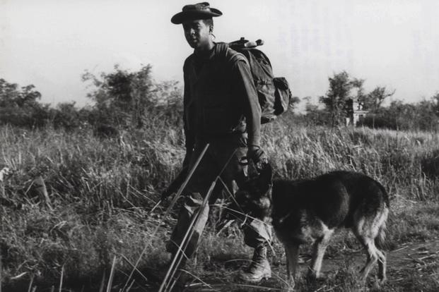 Nemo with his handler, Airman Robert Throneburg